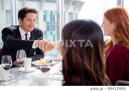 Happy team young business people in party celebrate success talking and introduce friends. Happy team young business people in party celebrate success talking and introduce friends. 99412893