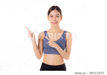 Portrait of beautiful young asian woman in sportwear smile and presenting isolated. Portrait of beautiful young asian woman in sportwear smile and presenting isolated. 99412973