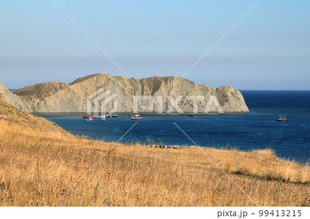 Seascape. Rocks, sea, sun, boats on a sunny day. Holidays at sea. landscape with boats and calm sea. Photo of a southern city without people. Tourism, advertising, summer Seascape. Rocks, sea, sun, boats on a sunny day. Holidays at sea. landscape with boats and calm sea. Photo of a southern city without people. Tourism, advertising, summer 99413215