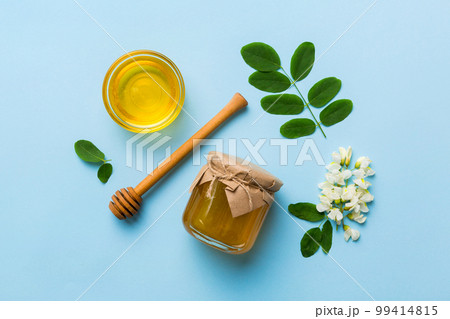 honey jar with acacia flowers and leaves. fresh honey top view flat lay 99414815