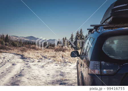 car for traveling with a winter mountain road 99416755