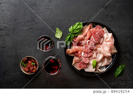 Appetizers with differents antipasti Appetizers with differents antipasti 99419254