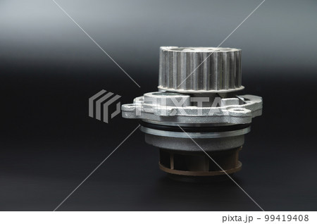 Close-up Automotive water pump, pump for pumping the coolant of the truck, part of the car engine cooling system. Black background, close-up, selective focus Close-up Automotive water pump, pump for pumping the coolant of the truck, part of the car engine cooling system. Black background, close-up, selective focus 99419408