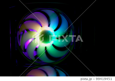 Computer cooler with RGB LED light. Computer circuit board and CPU cooling fans illuminated Computer cooler with RGB LED light. Computer circuit board and CPU cooling fans illuminated 99419451