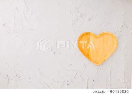 Empty heart shape wooden tray isolated on white cement background, top view, flat lay, dish plate or bowl wood for food, Collection, happy valentine day 99419886
