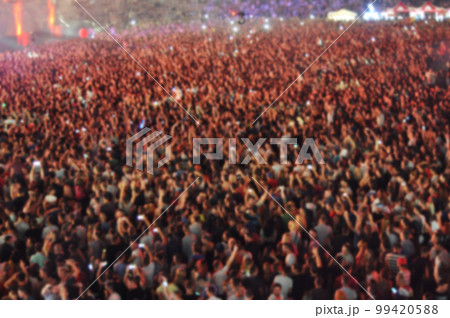 Blurred crowd of people partying Blurred crowd of people partying 99420588