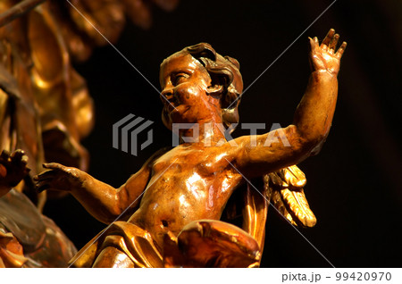 Wooden statue in a catholic church 99420970