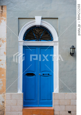 Traditional wooden painted blue door in Malta Traditional wooden painted blue door in Malta 99421288