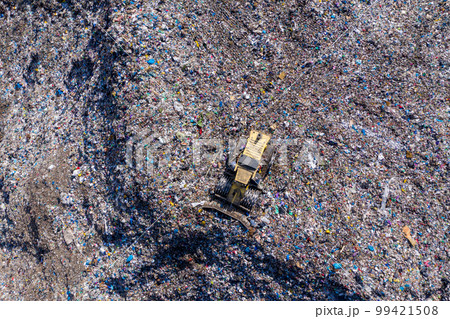 Aerial view of large landfill. Waste garbage dump, environmental pollution Aerial view of large landfill. Waste garbage dump, environmental pollution 99421508
