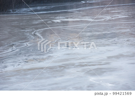 Muddy waters in a decantation pond. Toxic residuals from a copper mine decating in a settling basin Muddy waters in a decantation pond. Toxic residuals from a copper mine decating in a settling basin 99421569