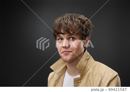 portrait of caucasian man with hairstyle in coat portrait of caucasian man with hairstyle in coat 99421587