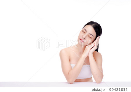 Beautiful natural woman looking at copy space, spa and wellness concept. Portrait of girl enjoying beauty treatment on white background. Carefree woman close her eyes on her hands. Beautiful natural woman looking at copy space, spa and wellness concept. Portrait of girl enjoying beauty treatment on white background. Carefree woman close her eyes on her hands. 99421855