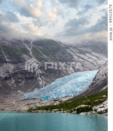 Summer overcast view to Nigardsbreen Glacier, Jostedal, Norway Summer overcast view to Nigardsbreen Glacier, Jostedal, Norway 99422679