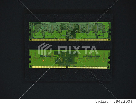 Green RAM strips on black foam. Computer chips close-up. Microchips and memory chips. 99422903