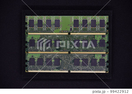 Green RAM strips on black foam. Computer chips close-up. Microchips and memory chips. Green RAM strips on black foam. Computer chips close-up. Microchips and memory chips. 99422912