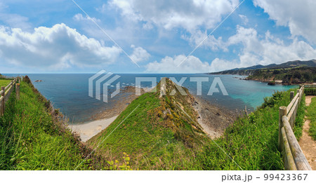 Summer Atlantic ocean (Biscay bay) coastline landscape. Ermita de La Regalina, Cadavedo, Asturias, Spain. Summer Atlantic ocean (Biscay bay) coastline landscape. Ermita de La Regalina, Cadavedo, Asturias, Spain. 99423367