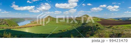 Amazing spring view on the Dnister River Canyon with picturesque rocks, fields, flowers. This place named Shyshkovi Gorby, Nahoriany, Chernivtsi region, Ukraine. Amazing spring view on the Dnister River Canyon with picturesque rocks, fields, flowers. This place named Shyshkovi Gorby, Nahoriany, Chernivtsi region, Ukraine. 99423470