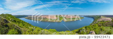 Amazing spring view on the Dnister River Canyon with picturesque rocks, fields, flowers. This place named Shyshkovi Gorby,  Nahoriany, Chernivtsi region, Ukraine. 99423471