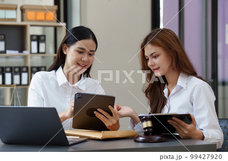 Business lawyer team working together in the private meeting. Law, legal services, advice, Justice concept. Business lawyer team working together in the private meeting. Law, legal services, advice, Justice concept. 99427920