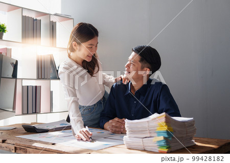 Group of Business accounting brainstorming and discussing fund investment at meeting. marketing plan in meeting room, investment concept. 99428182