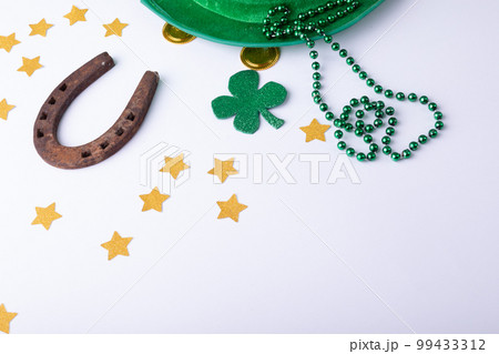 Top view photo of st patrick's day decorations with copy space on white background Top view photo of st patrick's day decorations with copy space on white background 99433312
