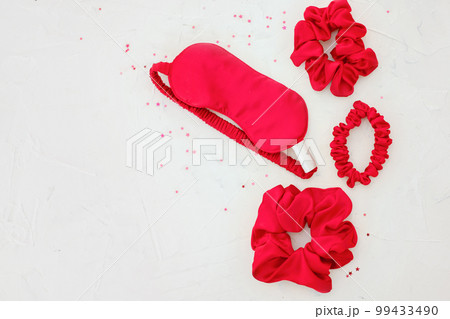 top view red accessories sleeping mask on grey background 99433490