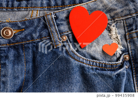 Close up of blue jeans with hearts Close up of blue jeans with hearts 99435908