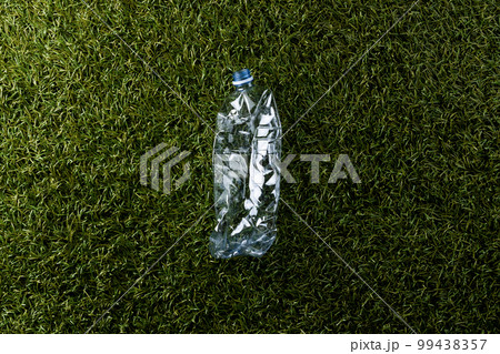 Close up of plastic bottle on grass background with copy space 99438357