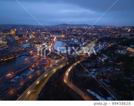 Aerial view of Oslo Downtown Skyline, Norway. Financial district and business centers in smart urban city in Europe. Skyscraper and high-rise buildings at night. 99438628