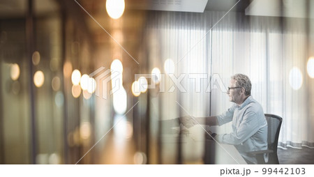 Composition of two happy diverse businesspeople shaking hands with motion blur 99442103