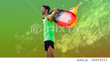 Composition of strong smiling caucasian male athlete holding german flag on green background Composition of strong smiling caucasian male athlete holding german flag on green background 99443915