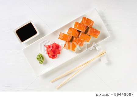 Sushi roll Philadelphia with salmon, smoked eel, avocado, cream cheese on white background 99448087