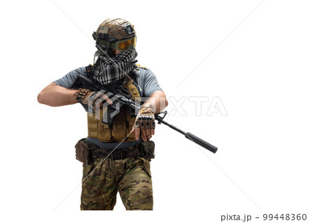 Special Mercenary soldie during a special operation with an automatic rifle standing and looking to copy space. Special Mercenary soldie during a special operation with an automatic rifle standing and looking to copy space. 99448360