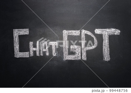 The word ChatGPT is written in white chalk on a black board. Chatbot culture, the age of artificial intelligence. The new reality of chatbots without people. The word ChatGPT is written in white chalk on a black board. Chatbot culture, the age of artificial intelligence. The new reality of chatbots without people. 99448756