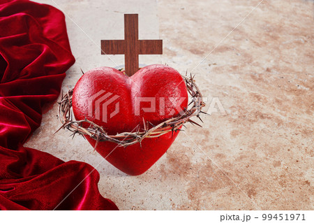 Sacred Heart of Jesus, surrounded by a crown of thorns and with wooden cross Sacred Heart of Jesus, surrounded by a crown of thorns and with wooden cross 99451971