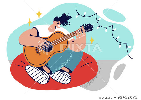 Man guitarist sits in chair with legs folded and plays guitar inventing own music 99452075