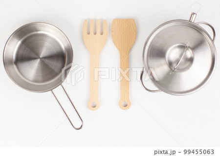 a metal pan with a wooden spatula for cooking 99455063