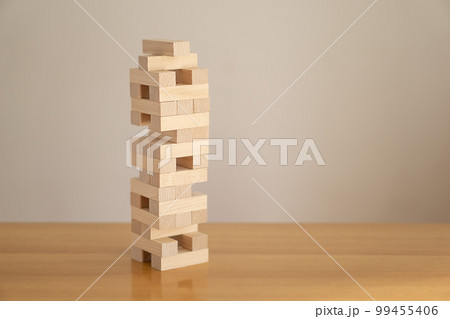 Tower of wood blocks. Concept of education, development, growth and risk. 99455406