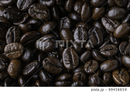 Background of roasted coffee beans. Photo Macro close up. 99456659