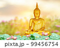 Makha Asanaha Visakha Bucha Day Golden Buddha image. Background of Bodhi leaves with shining light. Soft image and smooth focus style 99456754
