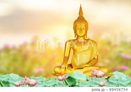 Makha Asanaha Visakha Bucha Day Golden Buddha image. Background of Bodhi leaves with shining light. Soft image and smooth focus style 99456754
