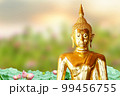 Makha Asanaha Visakha Bucha Day Golden Buddha image. Background of Bodhi leaves with shining light. Soft image and smooth focus style 99456755