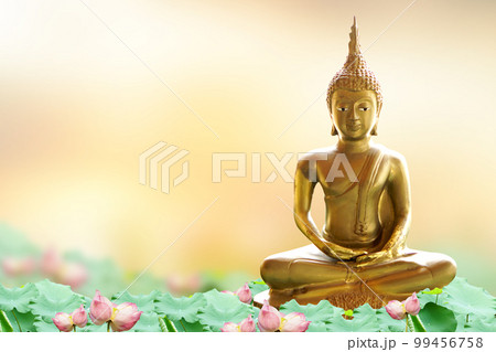 Makha Asanaha Visakha Bucha Day Golden Buddha image. Background of Bodhi leaves with shining light. Soft image and smooth focus style Makha Asanaha Visakha Bucha Day Golden Buddha image. Background of Bodhi leaves with shining light. Soft image and smooth focus style 99456758