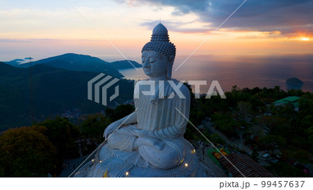 big buddha on high mountain in Phuket Thailand,Amazing light of sunset nature Landscape nature background 99457637