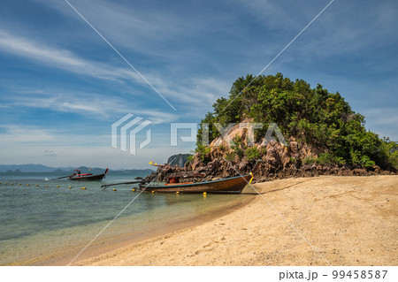 Tropical islands view with long tail boat ocean blue sea water and white sand beach at Koh Phak Bia, Krabi Thailand nature landscape 99458587