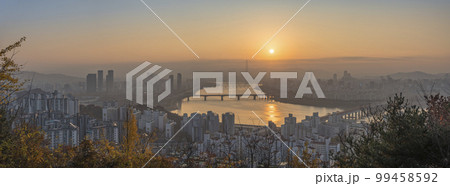 Seoul South Korea, panorama city skyline sunrise at Han River view from Maebong Mountain Park in autumn 99458592