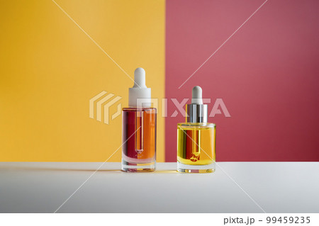 Pink and yellow face and hair oil on colored background Pink and yellow face and hair oil on colored background 99459235