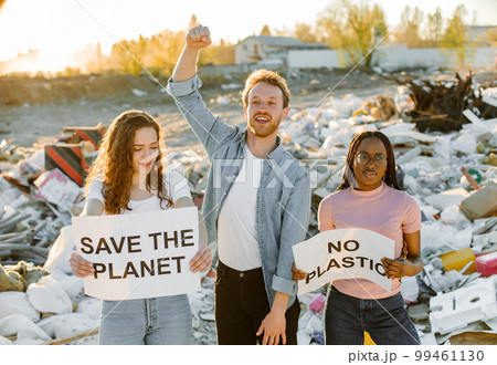 Young people are standing with posters SAVE THE PLANET and NO PLASTIC. Concept of environmental pollution and save Earth. 99461130