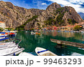 Croatia, City of Omis, a popular tourist destination for trekking and rafting on the Cetina river. Mountains, river, pleasure boats. 99463293
