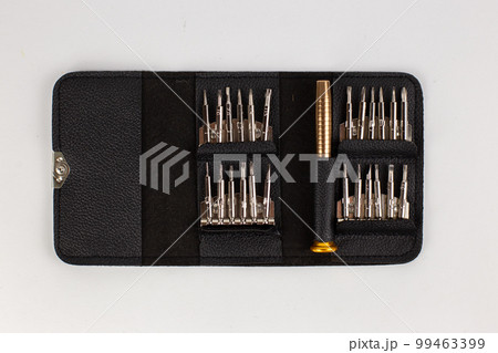 a set of screwdrivers in a leather case on a white background 99463399